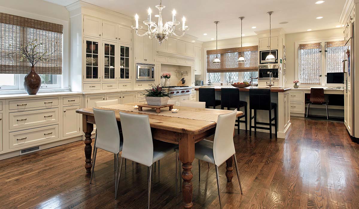 BK Flooring Services open kitchen dining area with hardwood floors