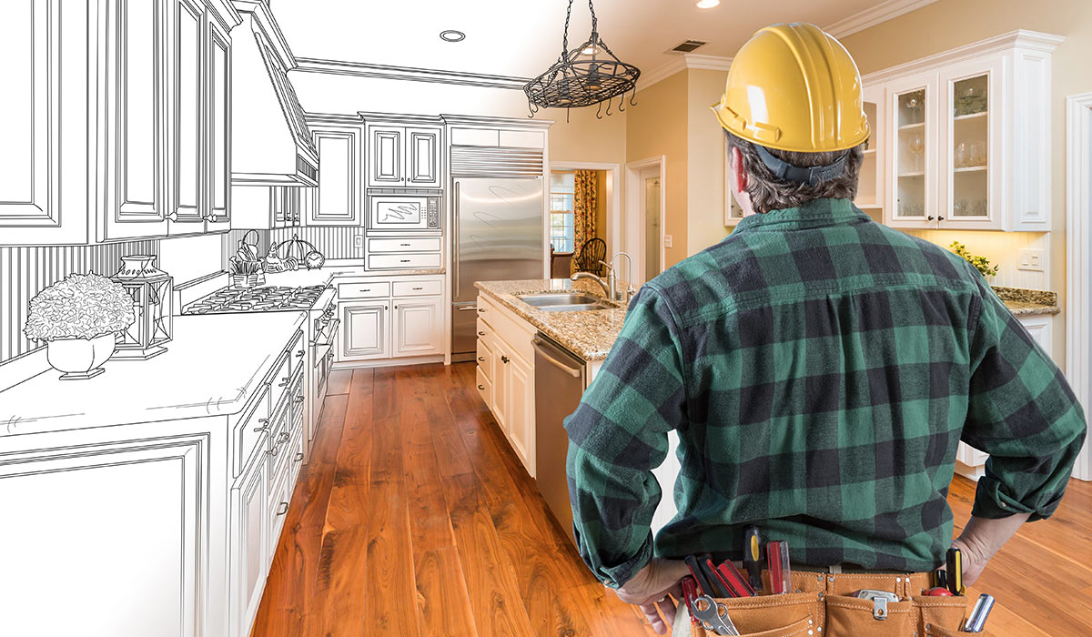 home-builder-looking-at-a-half-finished-kitchen