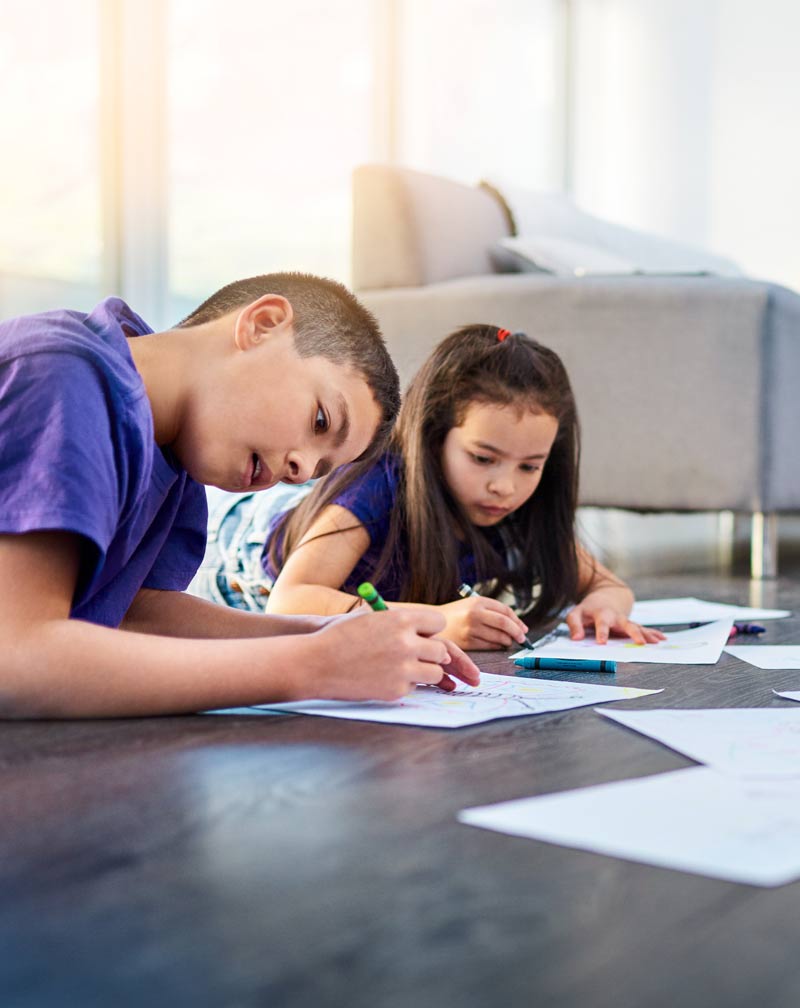 kids-coloring-books-on-wood-floor