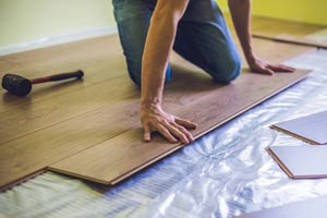 man-installing-hardwood-flooring