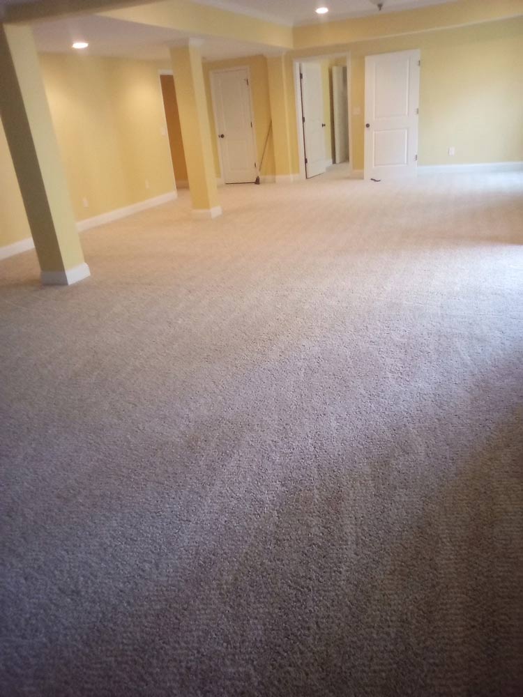 new-carpet-install-in-yellow-basement